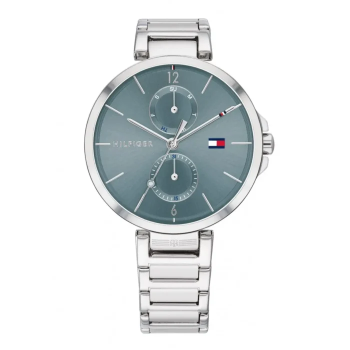 A sleek silver Tommy Hilfiger watch with a blue dial, featuring date and day indicators, and a modern bracelet design.
