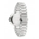 A side view of a silver stainless steel Tommy Hilfiger watch with a polished bracelet and minimalist round face design.