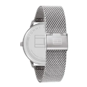 A sleek silver Tommy Hilfiger watch featuring a mesh strap and polished case, showcasing the brand logo on the back.