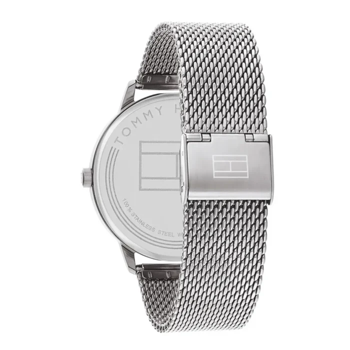 A sleek silver Tommy Hilfiger watch featuring a mesh strap and polished case, showcasing the brand logo on the back.