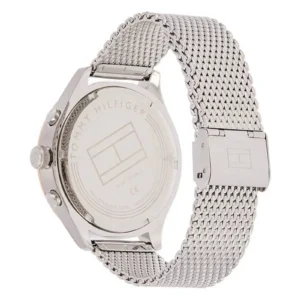 Silver Tommy Hilfiger watch with a mesh band; the back features the brand logo and details about the stainless steel material.