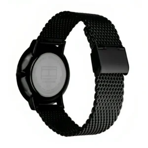 Black Tommy Hilfiger watch featuring a mesh strap and a round case, showcasing the brand logo on the back.
