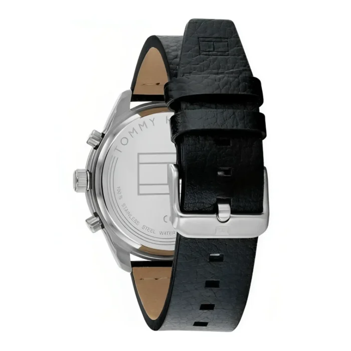 Back view of a Tommy Hilfiger watch featuring a stainless steel case and a black leather strap with a silver buckle.